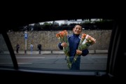 7a Avenue flower vendor in Bogotá, Colombia. ..Photo by Robert Caplin.