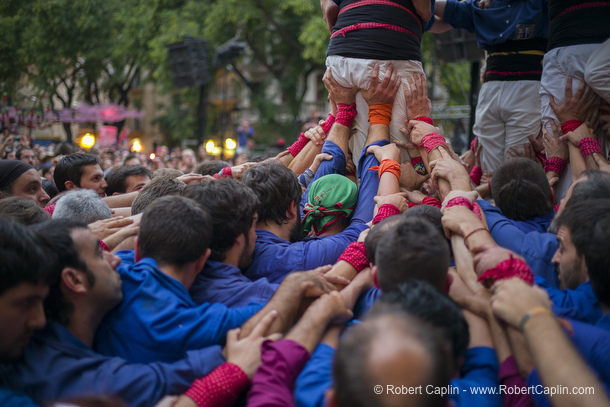 Castellers building human towers in Gracia, Barcelona.  Photo by Robert Caplin