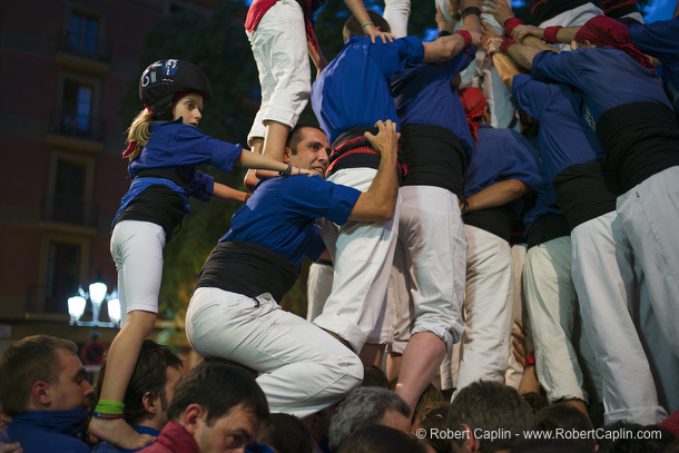 Castellers building human towers in Gracia, Barcelona.  Photo by Robert Caplin