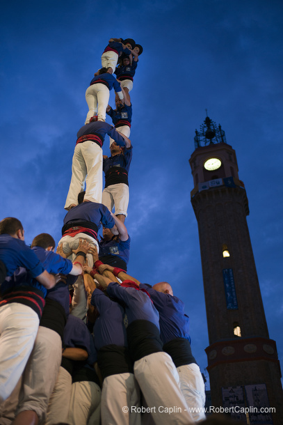 Castellers building human towers in Gracia, Barcelona.  Photo by Robert Caplin