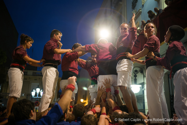 Castellers building human towers in Gracia, Barcelona.  Photo by Robert Caplin