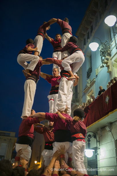 Castellers building human towers in Gracia, Barcelona.  Photo by Robert Caplin