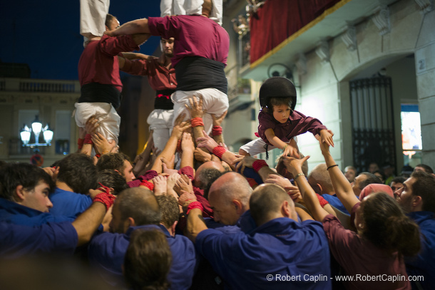 Castellers building human towers in Gracia, Barcelona.  Photo by Robert Caplin