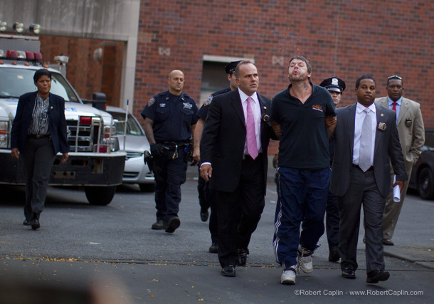 Central Park rapist perp walk, NYC. Photo Â© Robert Caplin